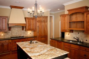 Custom Home Kitchen, Granite Countertops, Double Sink, Island w/ Utility Sink, Chandelier Lighting; Madison Custom Homes Inc., Indianapolis, Indiana