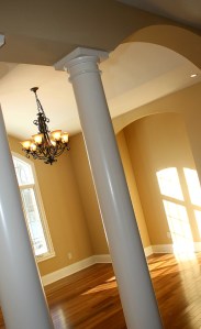 Luxury Home Dining Room, Column Entry, Wrought Iron Chandelier, Hardwood Floor - Madison Custom Homes Inc., Indianapolis, Central Indiana