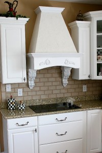 Carmel, Indiana Custom Home Kitchen, Flat-Panel Stovetop, Granite Counters, Faux-Brick Backsplash, Glass-Front Cabinets, Hardwood Floors; - Madison Custom Homes Inc., Indianapolis, Indiana