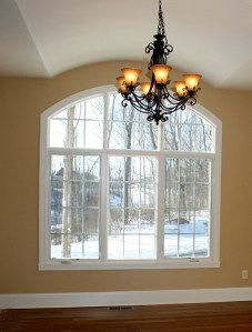 Luxury Home Fishers/Geist: Dining Room, Hardwood Floors, Arched Window, Chandelier Lighting, Madison Custom Homes Inc., Indianapolis, Indiana