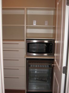 Custom Home Kitchen, Pantry Closet, Storage Drawers, Hide-Away Microwave Oven, Glass Door Wine Bottle Cooler - Madison Custom Homes Inc., Indianapolis, Indiana
