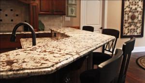 Close-Up of Granite Breakfast Bar, Matching Black Bar Stools &, Kitchen Appliances, Matching Stained Wood Cabinets & Floor