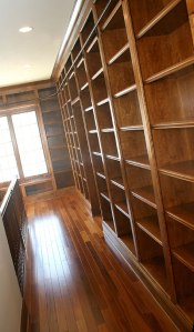 Architectural Design Detail: Library. Custom-Built Bookcases, Sliding Ladder Rail, Hardwood Floors; Homes Built to Your Specifications, Indianapolis, Indiana - Madison Custom Homes Inc.