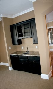 Wet Bar in Family Room, Built-In Glass Racks, Granite Counter, Wall-Mounted Cabinet