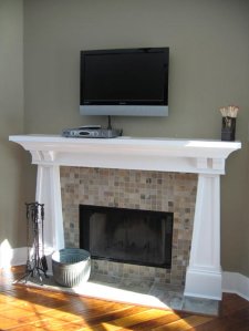Tiled Fireplace, Carved Wood Mantle, Wall-Mounted Flat Screen TV