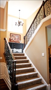 Luxury Home Foyer: Design Detail Close-up, Wrought Iron and Oak Banisters, Crown Molding Accent; Luxury Homes Built to Your Specifications; Indianapolis, Indiana - Madison Custom Homes Inc.