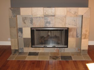 Luxury Home Great Room, Close-Up of Custom-Built Stone Tile Fireplace, Glass Fire Screen, Hardwood Floor; Indianapolis, Indiana - Madison Custom Homes Inc.