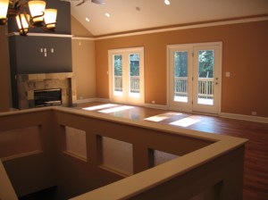 Luxury Home Great Room, Ceiling Fan, Custom Stone Fireplace, Double Glass Doors Open to Rear Deck, Recessed Lighting, Hardwood Floor, Carmel, Indiana - Madison Custom Homes Inc.