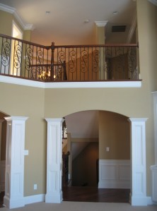 Design Detail: Arched Passageways, Hand-Crafted Columns, Wrought Iron / Oak Banister and Railing, Luxury Home Builder, Indianapolis, Indiana
