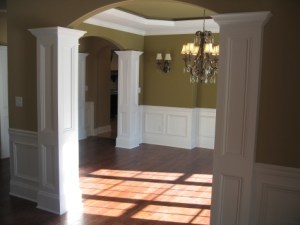 Design Detail: Arched Dining Room Entryways, Hand-Crafted Columns, Crystal Chandelier, Wall Sconces, Luxury Home Builder, Indianapolis, Indiana